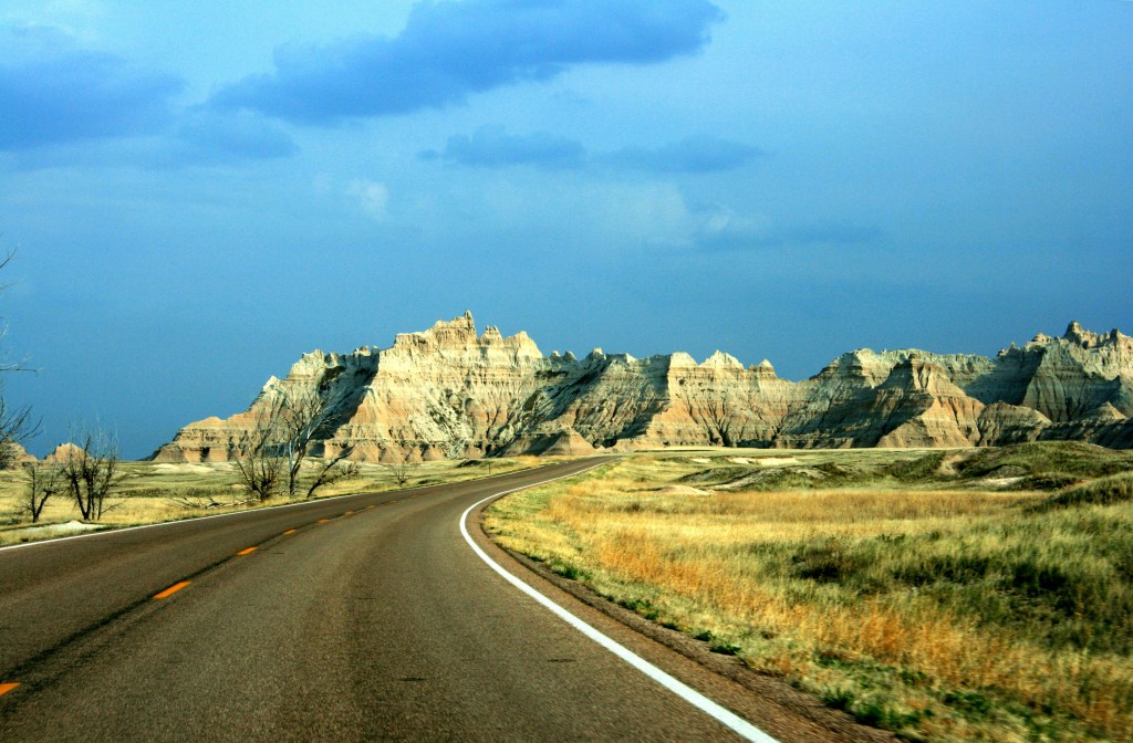 Road passing mountain ridge in South Dakota